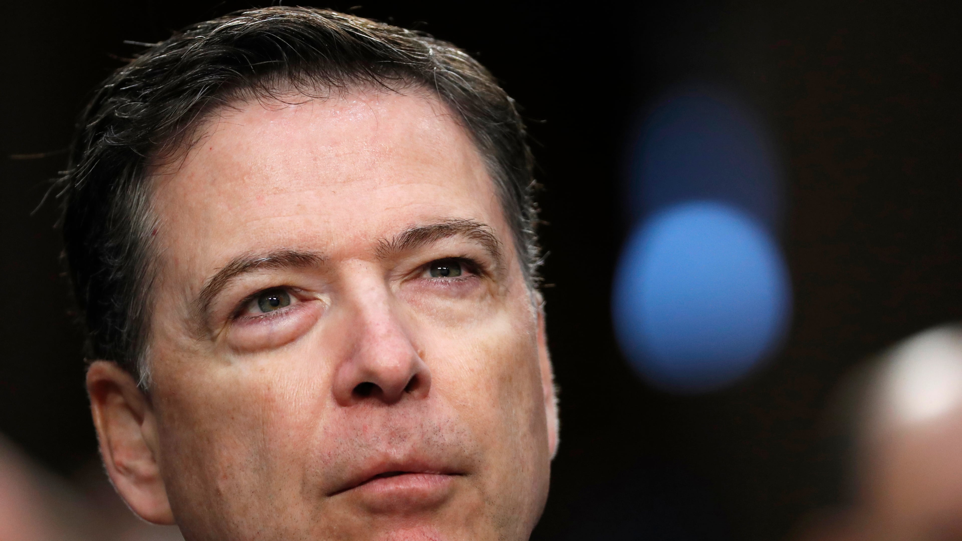 FILE - Former FBI Director James Comey pauses as he speaks during a Senate Intelligence Committee hearing on Capitol Hill, June 8, 2017, in Washington. (AP Photo/Alex Brandon, File)