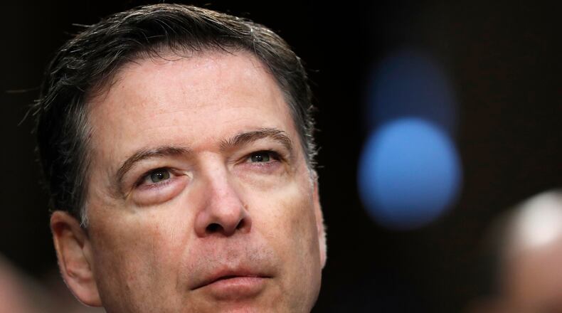 FILE - Former FBI Director James Comey pauses as he speaks during a Senate Intelligence Committee hearing on Capitol Hill, June 8, 2017, in Washington. (AP Photo/Alex Brandon, File)