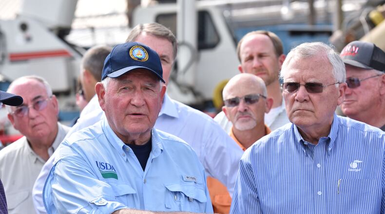October 16, 2018 Bainbridge - Secretary of Agriculture Sonny Perdue speaks as Governor Nathan Deal looks at Flint River Mills in Bainbridge on Tuesday, October 16, 2018. Vice President Mike Pence touched down in this Southwest Georgia city Tuesday and addressed the Sunbelt Agricultural Exposition in Moultrie as he surveyed storm damage from Hurricane Michael. Penceâs visit comes a day after President Donald Trump and First Lady Melania Trump traveled through the central part of the Peach State and met with farmers. HYOSUB SHIN / HSHIN@AJC.COM