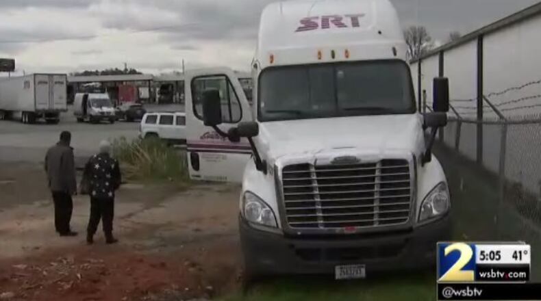 A woman’s body was found in the cab of a tractor-trailer in Forest Park. (Credit: Channel 2 Action News)