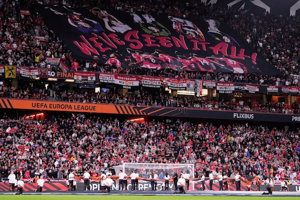 Manchester United fans cheer during the Europa League final soccer match between Tottenham Hotspur and Manchester United at the San Mames Stadium in Bilbao, Spain, Wednesday, May 21, 2025. (AP Photo/Jose Breton)