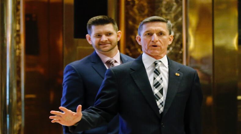 National security advisor Michael Flynn is seen with his son, Michael Flynn Jr., arriving at the Trump Tower for meetings with then US President-elect Donald Trump, in New York on November 17, 2016. (EDUARDO MUNOZ ALVAREZ/AFP/Getty Images)