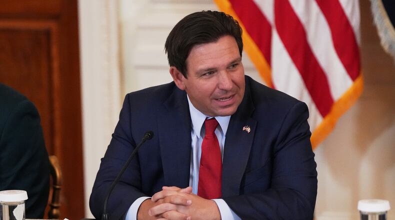 FILE - Florida Gov. Ron DeSantis is seen before a roundtable discussion on college sports in the East Room of the White House, Friday, March 6, 2026, in Washington. (AP Photo/Julia Demaree Nikhinson, File)