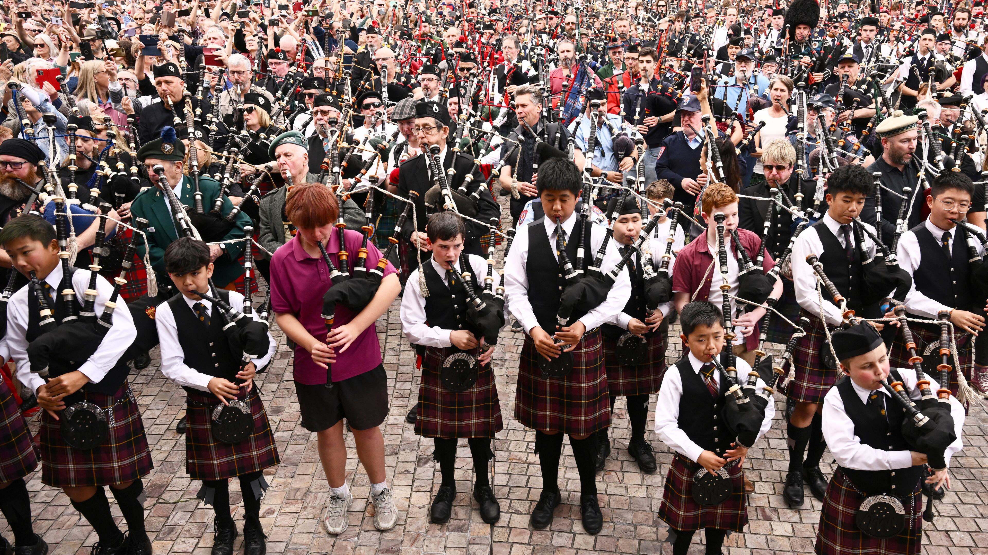Bagpipers gather to break a world record for the largest ever bagpipe ensemble playing "It's a Long Way to the Top" by Australian rock band AC/DC in Melbourne, Australia, Wednesday, Nov. 12, 2025. (Joel Carrett/AAP Image via AP)