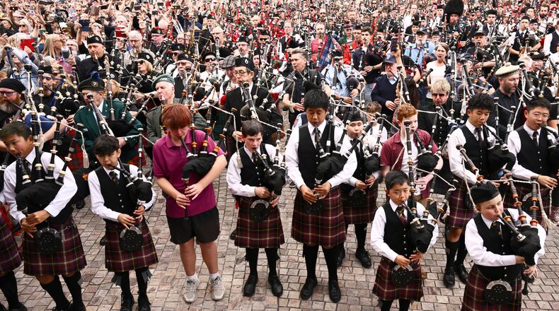 Bagpipers gather to break a world record for the largest ever bagpipe ensemble playing "It's a Long Way to the Top" by Australian rock band AC/DC in Melbourne, Australia, Wednesday, Nov. 12, 2025. (Joel Carrett/AAP Image via AP)