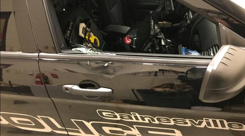 Police are searching for the person who stole a Gainesville police car before crashing it.