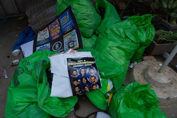 Posters and other paraphernalia are seen scattered outside the studio where Indian comedian Kunal Kamra allegedly made "defamatory" remarks against Shiv Sena politician Eknath Shinde, in Mumbai, India, Monday, March 24, 2025, after the venue was ransacked by Shiv Sena party workers. (AP Photo/Rafiq Maqbool)