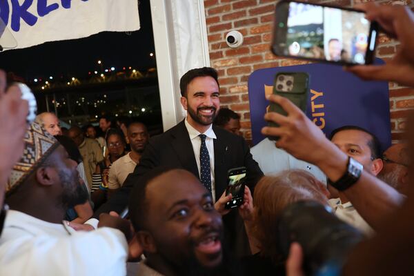 Democratic mayoral candidate Zohran Mamdani takes selfies with supporters after speaking at his primary election party, Wednesday, June 25, 2025, in New York. (AP Photo/Heather Khalifa)
