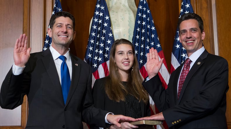 House Speaker Paul Ryan of Wis. administers the House oath of office to Rep. Tom Graves, R-Ga., during a mock swearing in ceremony on Capitol Hill in Washington, Tuesday, Jan. 3, 2017, as the 115th Congress began. (AP Photo/Jose Luis Magana)