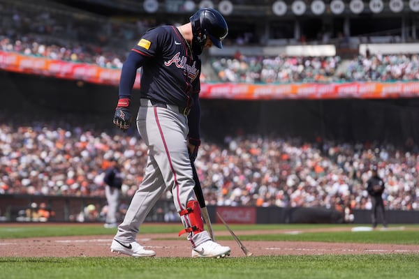 Atlanta Braves' Alex Verdugo breaks his bat on the ground after striking out against the San Francisco Giants during the ninth inning of a baseball game in San Francisco, Sunday, June 8, 2025. (AP Photo/Jeff Chiu)