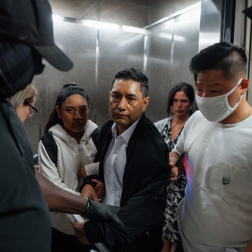 FILE - Immigration and Customs Enforcement agents pull a man out of an elevator as he and his daughter attempt to leave following a hearing in immigration court, Friday, Sept. 5, 2025, in New York. (AP Photo/Olga Fedorova,File)
