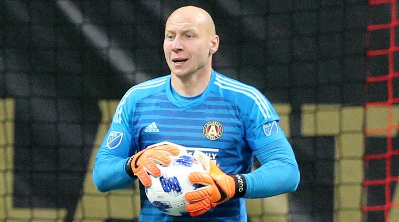 Atlanta United goalkeeper Brad Guzan after blocking a shot on goal by Sporting Kansas City during the first half in a MLS soccer match on Wednesday, May 9, 2018, in Atlanta. Guzan was red carded and ejected later in the game.  Curtis Compton/ccompton@ajc.com