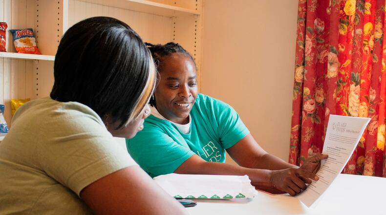 A participant from Southwest Georgia enrolls into the In Her Hands guaranteed income initiative. Image Credit: In Her Hands