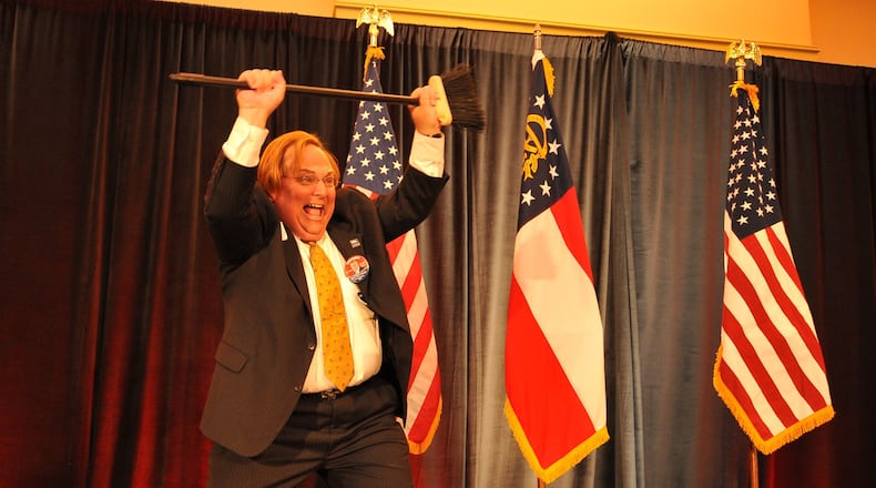 A former Gainesville Times reporter, Harris Blackwood had little in his background suggesting expertise in highway safety before Gov. Nathan Deal put him in charge of that division of his office. Known as an office cutup, he’s seen here claiming a “sweep” for Republicans at a 2010 election night event. BRANT SANDERLIN / AJC