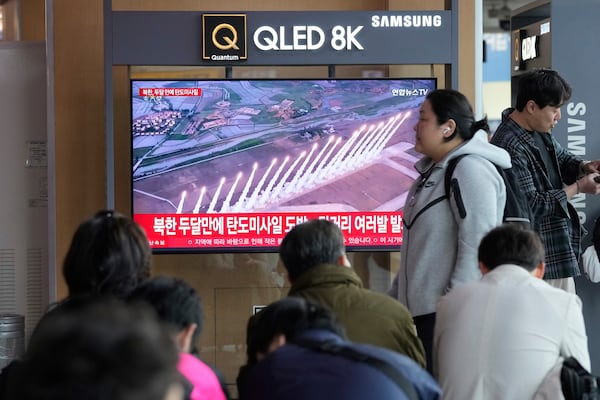 A TV screen shows a file image of North Korea's missiles launch during a news program at Seoul Railway Station in Seoul, South Korea, Thursday, May 8, 2025. (AP Photo/Ahn Young-joon)