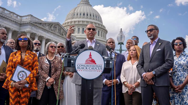 FILE - House Minority Leader Hakeem Jeffries, D-N.Y., center, and members of the Congressional Black Caucus speak outside the Capitol in Washington, May 19, 2026. (AP Photo/J. Scott Applewhite, File)