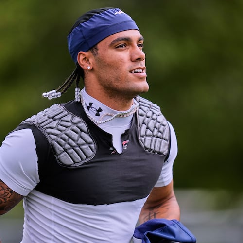 New England Patriots cornerback Christian Gonzalez runs towards a practice field during the team's NFL football training camp, Tuesday, Aug. 25, 2026, in Foxborough, Mass. (AP Photo/Charles Krupa)