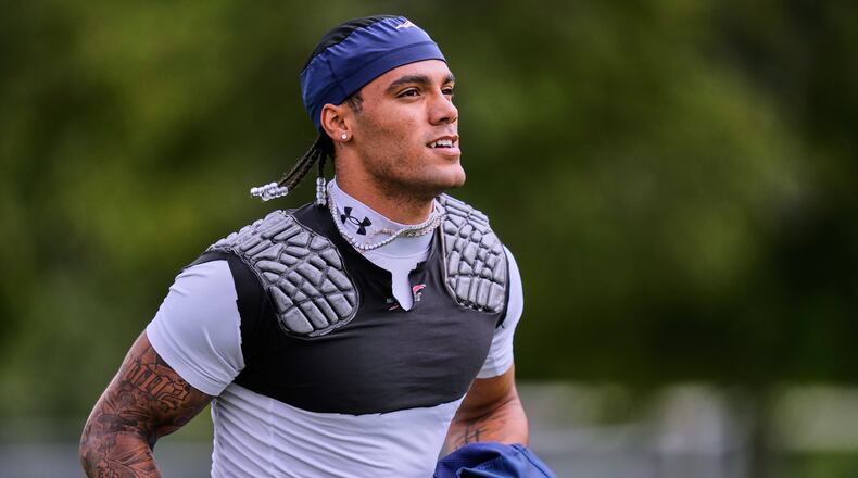 New England Patriots cornerback Christian Gonzalez runs towards a practice field during the team's NFL football training camp, Tuesday, Aug. 25, 2026, in Foxborough, Mass. (AP Photo/Charles Krupa)
