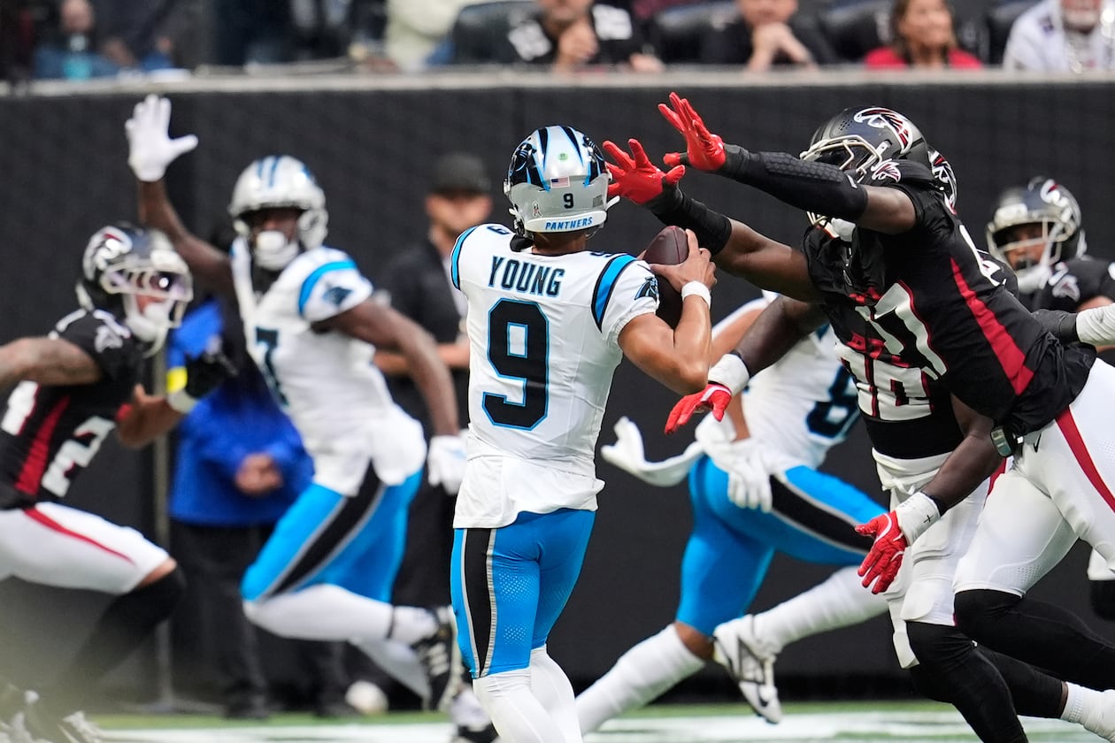 Carolina Panthers quarterback Bryce Young (9) is sacked by Atlanta Falcons linebacker James Pearce Jr. (27) on a 2-point conversion attempt in the second half of an NFL football game, Sunday, Nov. 16, 2025, in Atlanta. (AP Photo/Mike Stewart)
