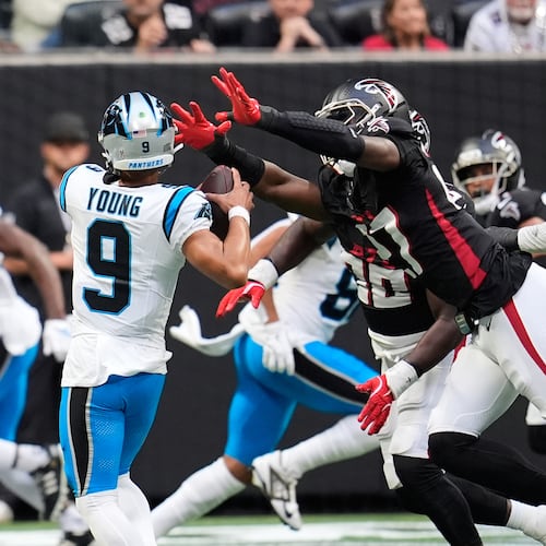 Carolina Panthers quarterback Bryce Young (9) is sacked by Atlanta Falcons linebacker James Pearce Jr. (27) on a 2-point conversion attempt in the second half of an NFL football game, Sunday, Nov. 16, 2025, in Atlanta. (AP Photo/Mike Stewart)
