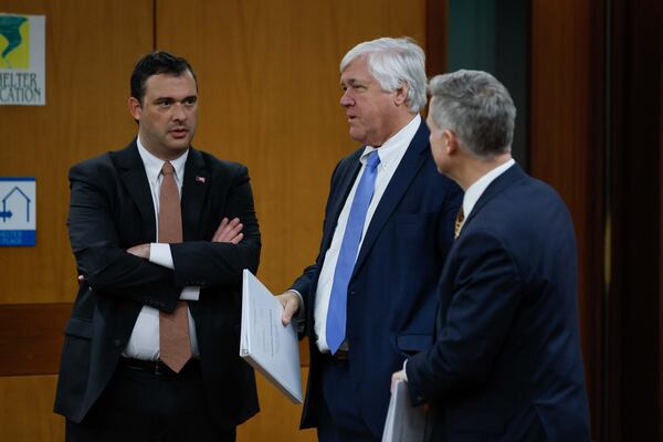 Josh Belinfante, left, speaks with Bill Cowsert, R-Athens, chairman of the Senate Select Committee on Investigation, and Sen. John Kennedy, R-Macon, at the Fulton County Superior Court before a hearing on Tuesday, December 3, 2024. They argued that a state Senate committee investigating Fulton County District Attorney Fani Willis can compel her to testify.
(Miguel Martinez / AJC)