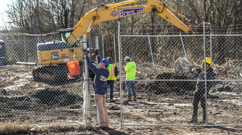 February 6, 2023 Atlanta Law enforcement was out en masse Monday morning, Feb. 6, 2023 at the site of Atlanta’s proposed public safety training center, clearing the woods in anticipation of construction on the controversial facility beginning in earnest. SWAT teams from the Atlanta, DeKalb County police departments, as well as Georgia State Patrol troopers and representatives from other agencies, were seen at the site in southwest DeKalb County. Construction contractors were also there with equipment. Amid the beeping of trucks backing up and the clanging of heavy equipment off Key Road, construction workers busily prepared the site with a backhoe and a bulldozer. Police officers in olive green uniforms patrolled the area atop all-terrain vehicles. The operation was taking place several days after officials announced that initial land disturbance permits had been approved for the $90-million facility — and about three weeks after a similar clearing operation resulted in the death of 26-year-old Manuel “Tortuguita” Teran. During that fatal Jan. 18 incident, Teran is accused of firing at troopers “without warning,” wounding one. Teran died after several other troopers returned fire, the Georgia Bureau of Investigation has said. (John Spink / John.Spink@ajc.com)