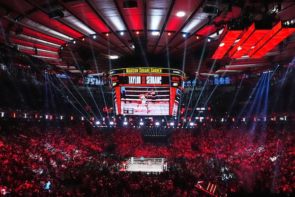 Fans watch Puerto Rico's Amanda Serrano fight Ireland's Katie Taylor during the first round of a super lightweight championship boxing match Friday, July 11, 2025, in New York. (AP Photo/Frank Franklin II)
