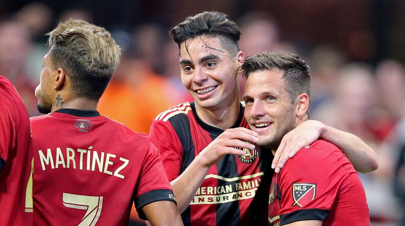 April 28, 2018 Atlanta: Atlanta United midfielder Kevin Kratz (right) celebrates scoring his second goal of the game, both on free kicks, with Miguel Almiron for a 4-1 victory over the Montreal Impact in a MLS soccer match on Saturday, April 28, 2018, in Atlanta. Almiron also scored two goals in the game. Curtis Compton/ccompton@ajc.com
