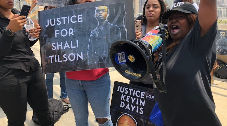 Tynesha Tilson (right), the mother of Shali Tilson, speaks out against her son’s death during an Aug. 24 protest on the 17th St. bridge near Atlantic Station in Atlanta. Shali Tilson, 22, died in March while being held at the Rockdale County Jail. WILLOUGHBY MARIANO/wmariano@ajc.com