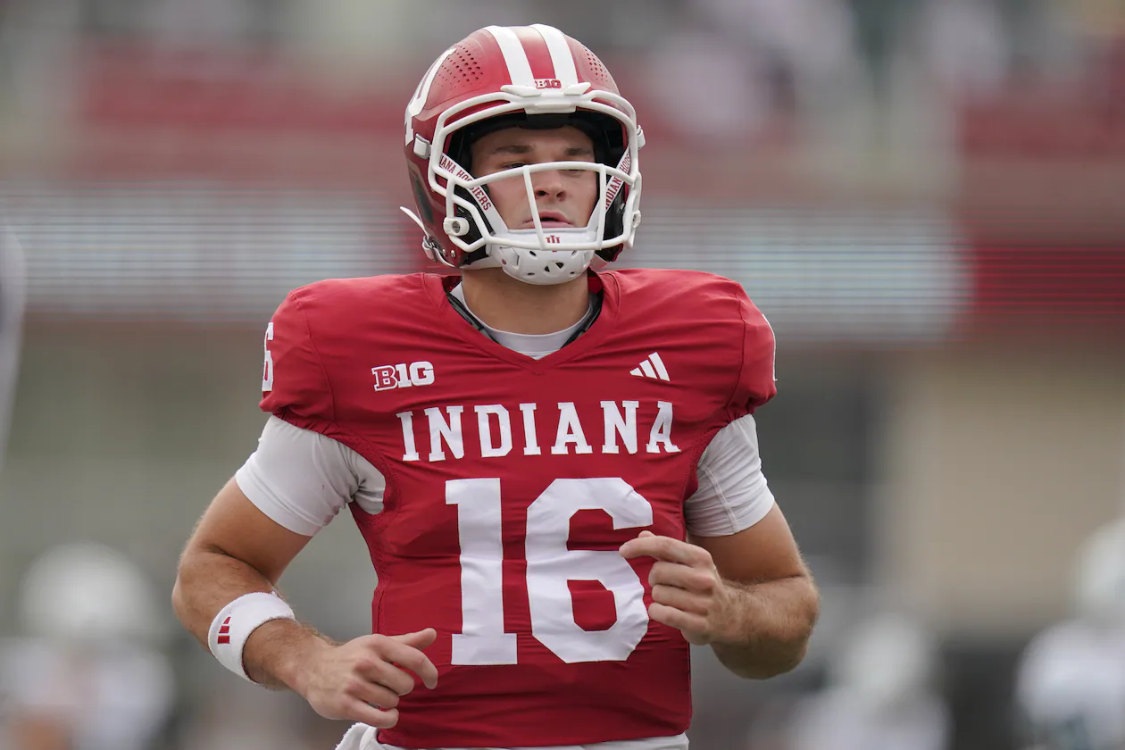 Indiana quarterback Alberto Mendoza — pictured warming up against Michigan State in October — has entered the transfer portal, and Georgia Tech is reportedly "among the early teams to watch" for adding him. (Vera Nieuwenhuis/AP 2025)
