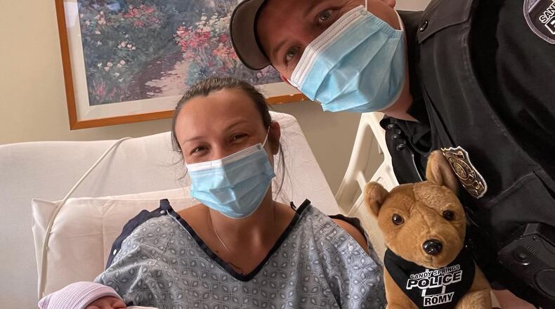 Officer Patrick Burt helped a family deliver their baby after discovering the mother in labor on the side of the road.