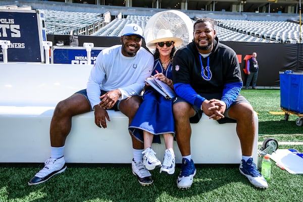 Colts team owner Carlie Irsay-Gordon is no stranger to the game-day sidelines, and she's made an impression on her players, including defensive end Tyquan Lewis (left) and defensive tackle Grover Stewart. (Courtesy of Indianapolis Colts)