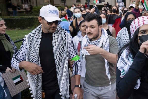 Mohsen Mahdawi, left, and Mahmoud Khalil participate during a pro-Palestinian protest at Columbia University, Thursday, Oct. 12, 2023, in New York. (AP Photo/Yuki Iwamura)
