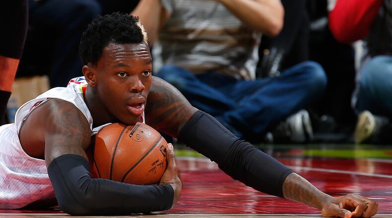 ATLANTA, GA - FEBRUARY 19: Dennis Schroder #17 of the Atlanta Hawks reacts after drawing a foul from Beno Udrih #19 of the Miami Heat at Philips Arena on February 19, 2016 in Atlanta, Georgia. NOTE TO USER User expressly acknowledges and agrees that, by downloading and or using this photograph, user is consenting to the terms and conditions of the Getty Images License Agreement. (Photo by Kevin C. Cox/Getty Images)