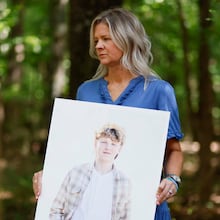 Ashley Worthey holds a portrait of her son, Mason Worthey, at her home in Good Hope, Ga., on Sunday, Aug. 9, 2026. She lost her 17-year-old son on March 6. As Suicide Prevention Month approaches, Ashley shares her story to support other families. (Miguel Martinez/AJC)