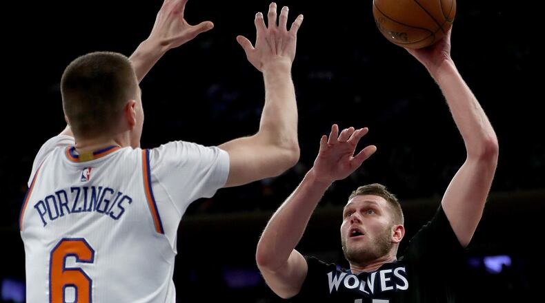 Cole Aldrich of the Minnesota Timberwolves heads for the net as Kristaps Porzingis of the New York Knicks defends at Madison Square Garden on December 2, 2016 in New York City.  (Photo by Elsa/Getty Images)