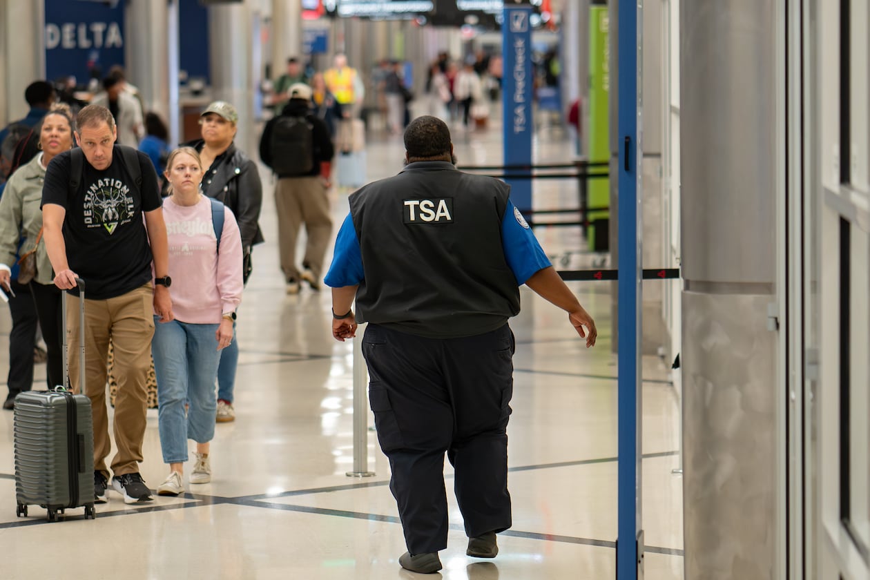 A TSA officer walks through Terminal South at Hartsfield-Jackson Atlanta International Airport on March 30, 2026. More workers are returning to the airport now that they're being paid again. (Ben Hendren for the AJC)