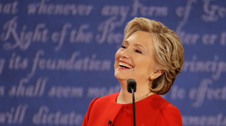 Democratic presidential nominee Hillary Clinton laughs to Republican presidential nominee Donald Trump during the presidential debate at Hofstra University in Hempstead, N.Y., Monday, Sept. 26, 2016. (AP Photo/Julio Cortez)