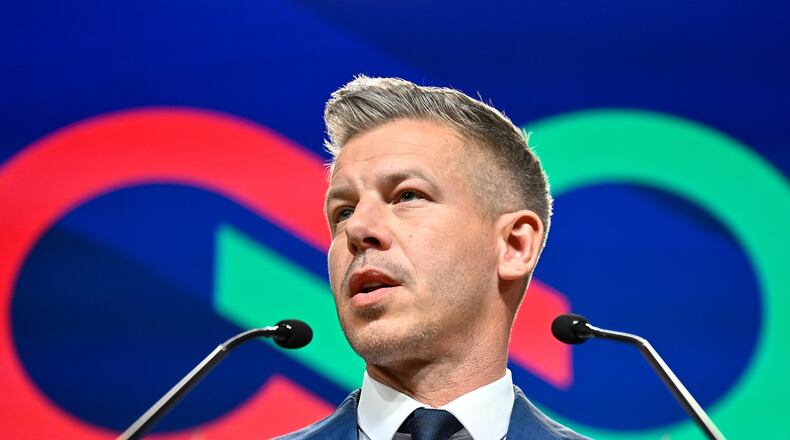 Peter Magyar speaks to the media in Budapest, Hungary, Monday, April 13, 2026, after defeating Prime Minister Viktor Orban's party in the country's parliamentary elections. (AP Photo/Denes Erdos)