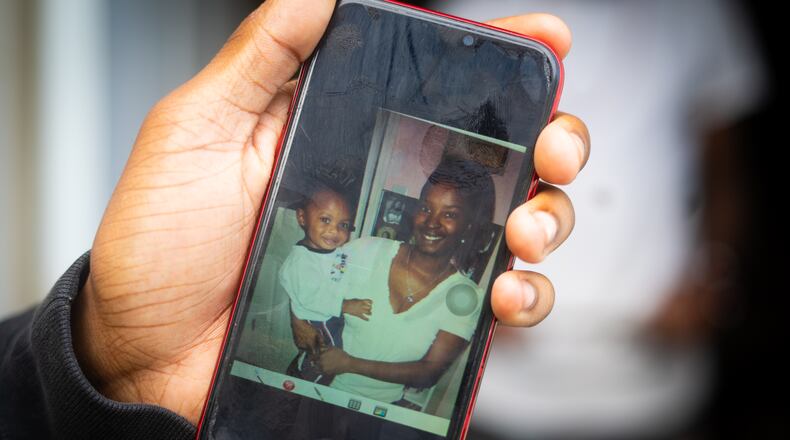 Christian Cardenas holds photo of himself and his mother Candi Shavon Miller who passed away from complications of abortion in the year of 2022. September 16th, 2024. Atlanta, GA