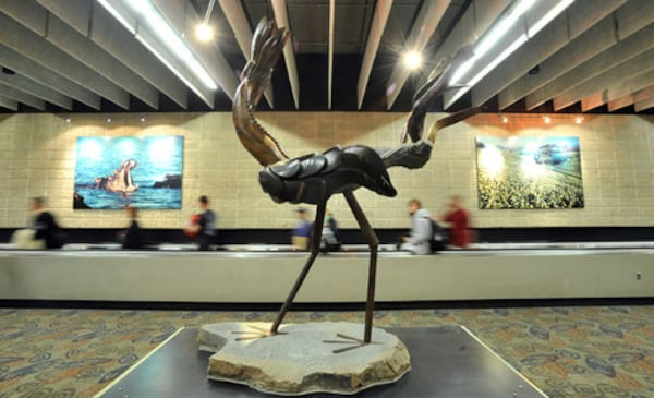 A contemporary stone sculpture from Zimbabwe, which debuted in 2001, is located on the pedestrian corridor of the Transportation Mall between Concourse T and Concourse A. (AJC FILE)