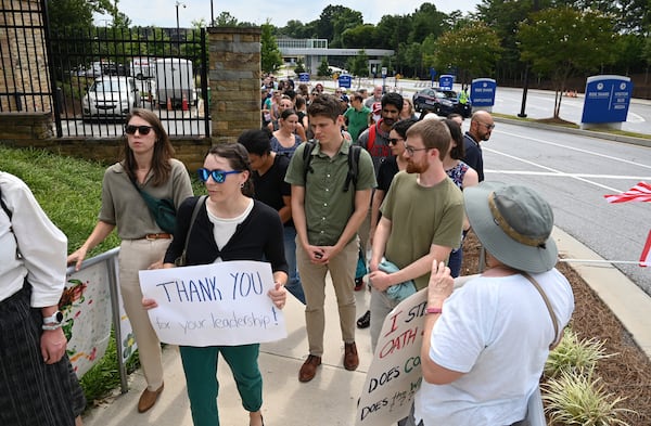 CDC workers walk off to rally for departing leaders at the Centers for Disease Control and Prevention outside the CDC headquarters, Thursday, August 28, 2025, in Atlanta. (Hyosub Shin/AJC)