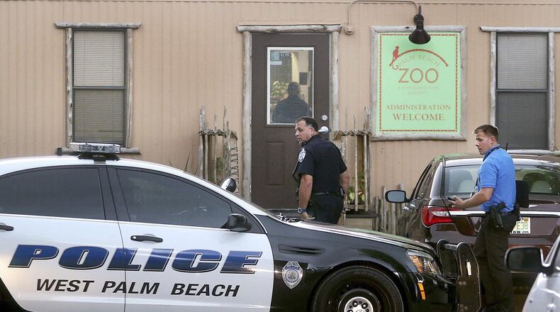 Police officers enter the administration building at the Palm Beach Zoo after a zookeeper was said to have been mauled to death by a tiger Friday afternoon, April 15, 2016 at the Zoo. It took 17 minutes for rescue personnel to reach zookeeper Stacey Konwiser, who had been fatally mauled. (Damon Higgins / The Palm Beach Post)
