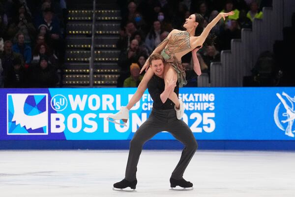 Madison Chock and Evan Bates, of the United States, perform during the ice dance free dance program at the figure skating world championships, Saturday, March 29, 2025, in Boston. (AP Photo/Charles Krupa)