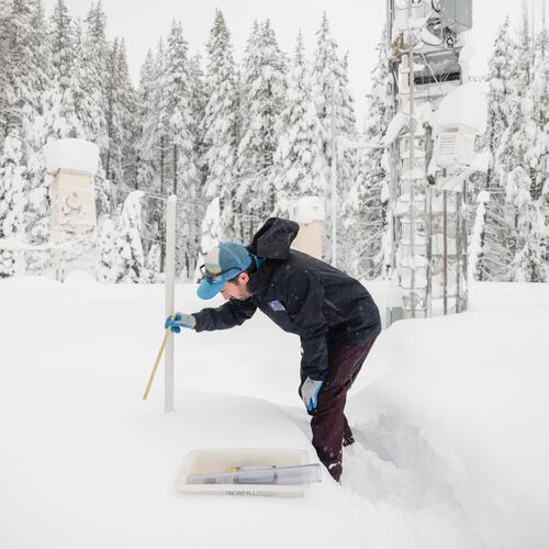FILE - Dr. Gabe Lewis, a research scientist, measures snow depth and mass to calculate density and snow water equivalent at Central Sierra Snow Lab in Soda Springs, Calif. on Monday, Jan. 5, 2026. (Brontë Wittpenn /San Francisco Chronicle via AP, File)