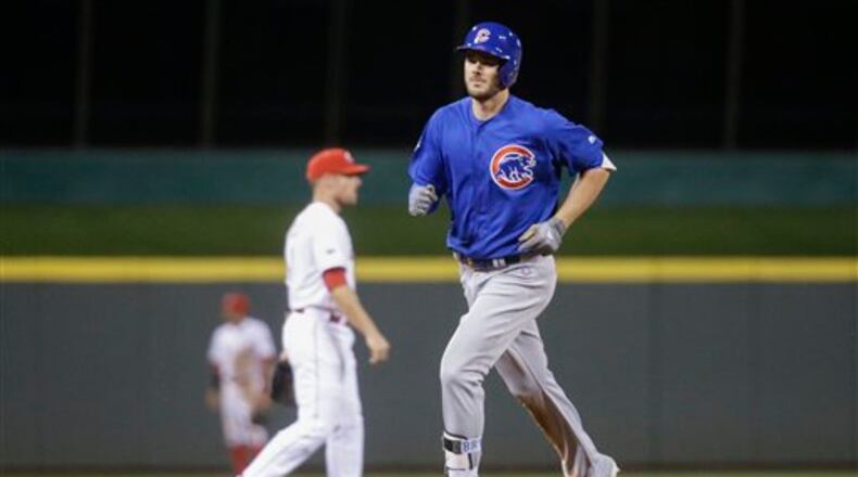 Chicago Cubs' Kris Bryant runs the bases after hitting a solo home run off Cincinnati Reds relief pitcher Ross Ohlendorf in the eighth inning of a baseball game, Monday, June 27, 2016, in Cincinnati. The Cubs won 11-8. (AP Photo/John Minchillo)