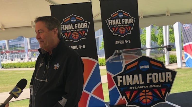Carl  Adkins, executive director of the Atlanta Basketball Host Committee, answers questions after a Final Four news conference outside Mercedes-Benz Stadium on Wednesday.
