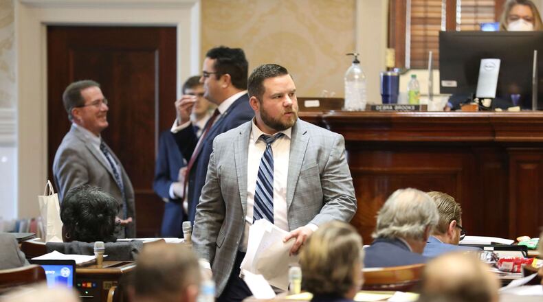 FILE - South Carolina Rep. RJ May, R-West Columbia, walks down the aisle of the House on Tuesday, March 14, 2023, in Columbia, South Carolina. (AP Photo/Jeffrey Collins,File)