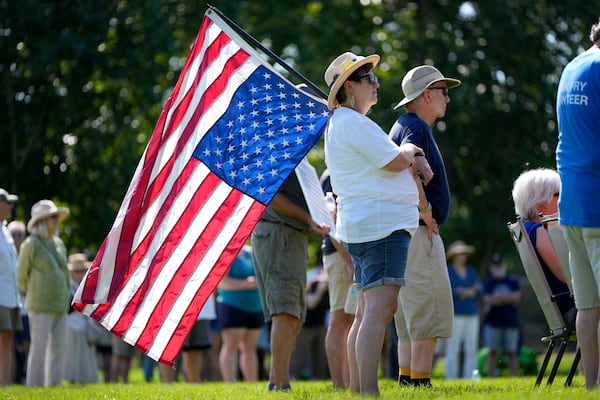 Theresa Peiffer, of Polk City, Iowa, listens to a speaker during an Iowa Democratic Party rally, Thursday, July 3, 2025, in Windsor Heights, Iowa. (AP Photo/Charlie Neibergall)
