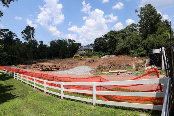 Cleared trees next to Mimosa Hall are shown on Monday, June 23, 2025, in Roswell. The removal of trees outside the antebellum property, part of a plan to connect green spaces, prompted an outcry in June. (Jason Getz/AJC)
